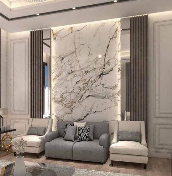 مهندس ديكور يشرف على تركيب ديكور داخلي مودرن يجمع بين بديل الرخام وبديل الخشب وإضاءة ليد في صالة فيلا بالمنطقة الشرقية